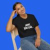 Female model wearing a black Adam Copeland graphic tee black