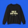 Ride At Da'wn graphic on a black crewneck sweatshirt
