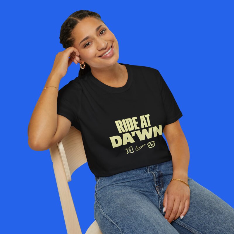 Female model wearing a black Ride At Da'wn graphic tee